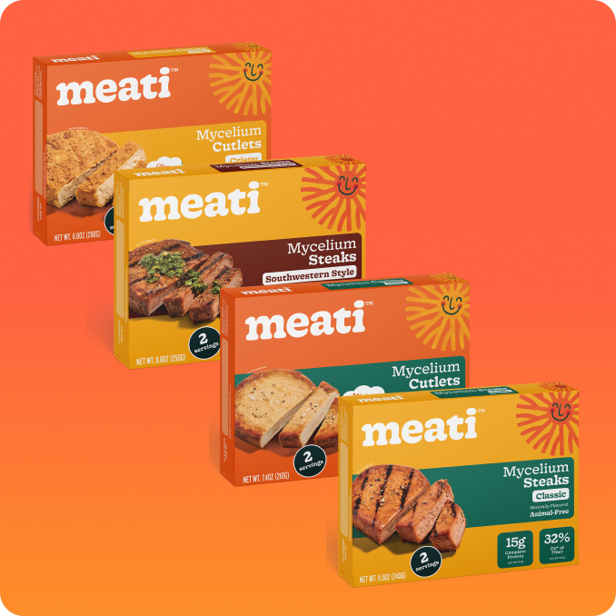 Four boxes of meati mycelium products on an orange background